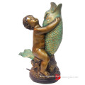 Garden garden bronze boy statue riding a fish